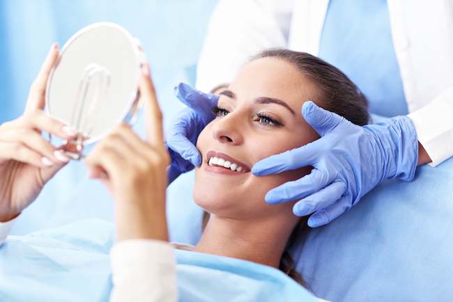 Image of a woman smiling after her crown lengthening treatment at Palo Alto Oral Health.
